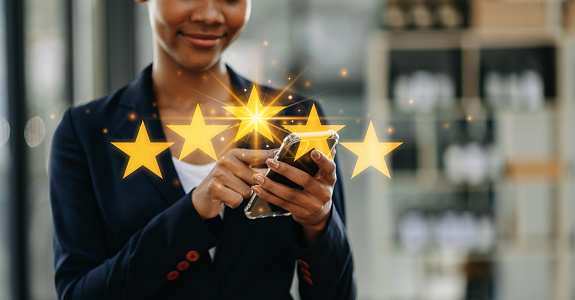 Customer or client the stars to complete five stars. with copy space. giving a five star rating. Service rating, satisfaction concept.