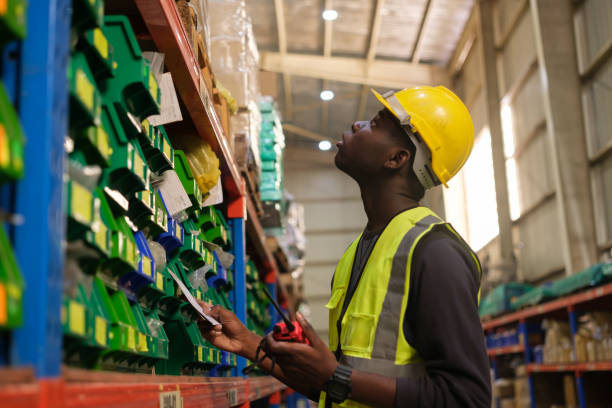 istock Industrial worker working at warehouse factory. 1618326476
