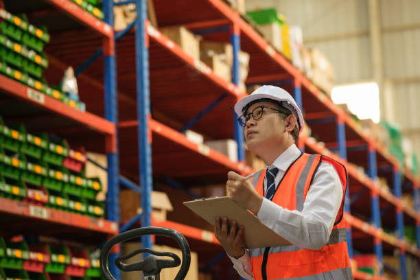 istock Industrial worker working at warehouse factory. 1618338837