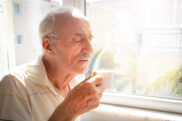 istock The man is drinking coffee looking out the window 1618346337