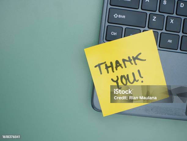 Top View Of Words Thank You Written On Sticky Note On Laptop Keyboard Stock Photo - Download Image Now