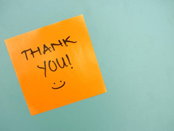 istock Top view of words thank you written on sticky note with copy space 1618377530