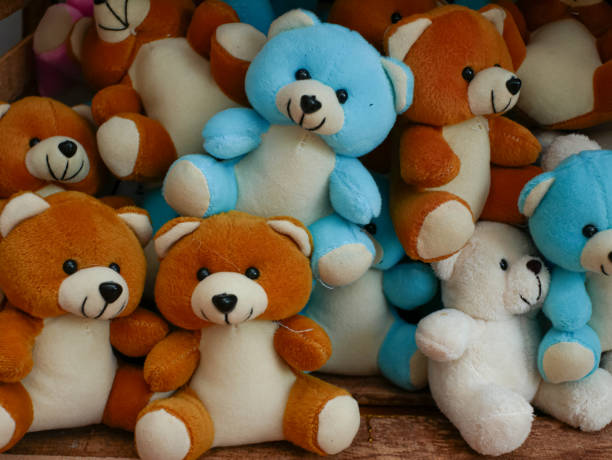 stacks of blue, brown, and white teddy bears