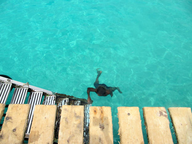 African boy diving in the sea