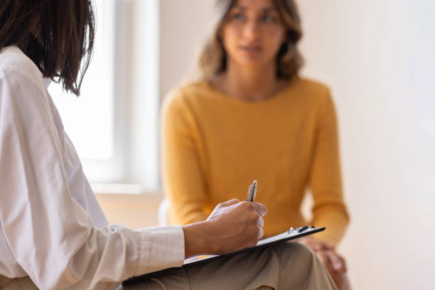istock Psychologist is listening to problems of her 1618389058
