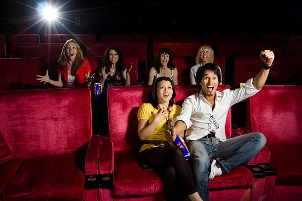 cinema Group of people sitting in the cinema and watching a move happy end stock pictures, royalty-free photos & images