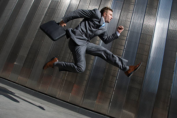 istock Modern Businessman Jumping Office Building City Sidewalk 161840013