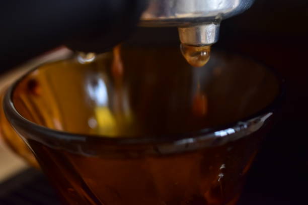 istock Close up of process of making espresso coffee on a coffee machine 1618404385