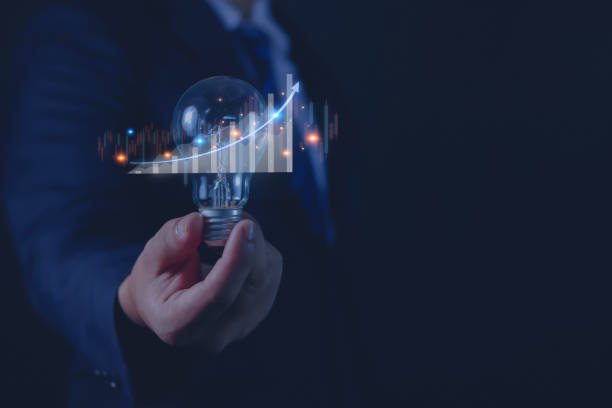 istock Businessman working on stock on light bulbs 1618408407