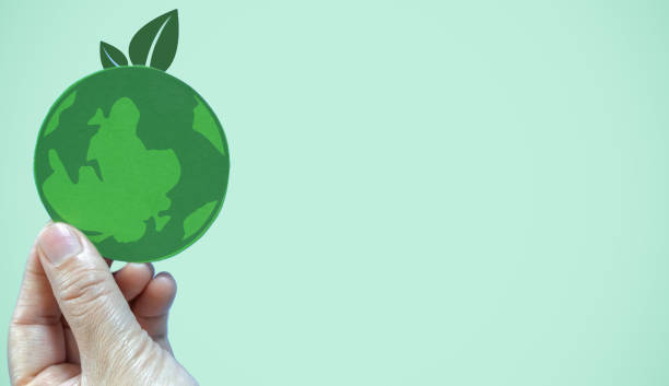 istock Hand holding paper cut saving clean energy earth globe world environment green eco friendly, save planet, csr social responsibility.campaign save the earth and earth Day 22 April 1618449131