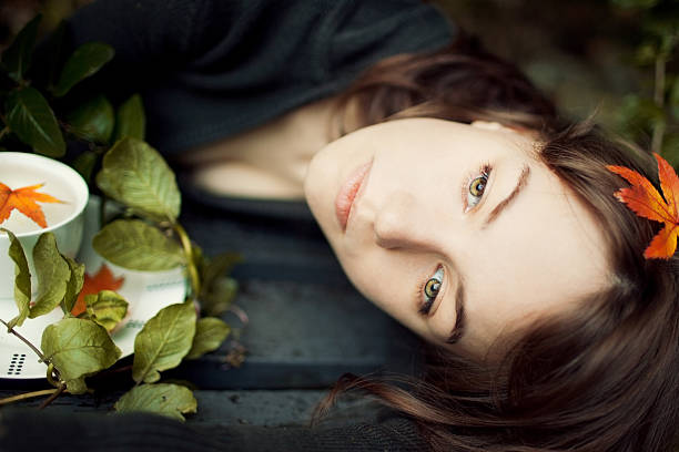Portrait of a girl in autumn forest 