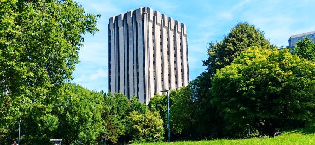 istock Tower Amidst Lush Greens and Towering Trees