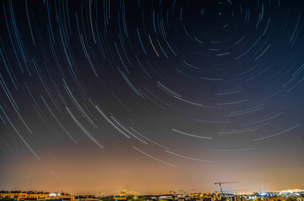 istock Circumpolar night sky on the city 1618465500