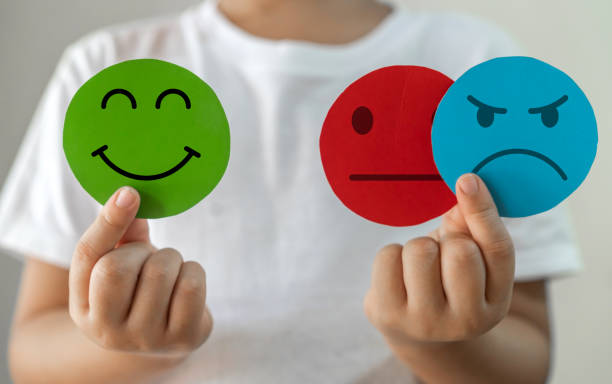 istock Child kid hand holding paper cut circle face different emotion, emotions, happy, relax, satisfaction survey, customer services, positive, good, wellness, health child, hospital, world mental health day 1618478077
