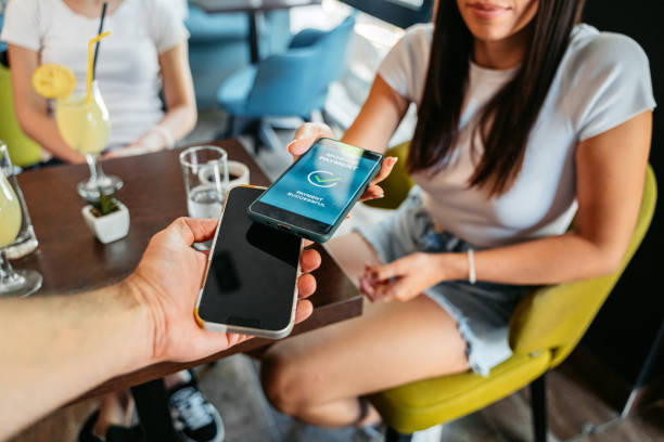 istock Young Woman Paying Via Contactless Channel By Mobile Banking Application 1618512094