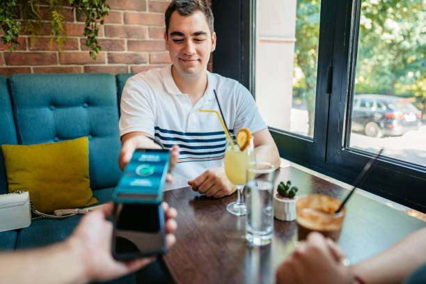 istock Young Man Paying Via Contactless Channel By Mobile Banking Application 1618512645