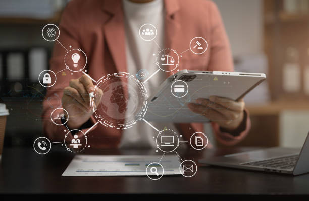 istock Copyright or patent concept, Person hand using laptop computer, tablet and smartphone with virtual screen copyright icon trademark, Creation ownership against piracy at office. 1618516551