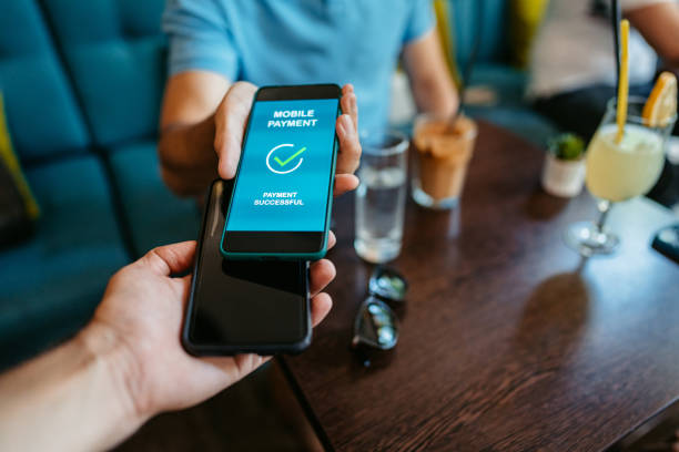 istock Young Man Paying Via Contactless Channel By Mobile Banking Application 1618522498
