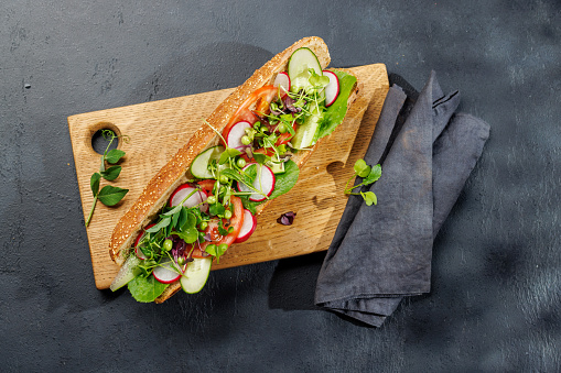 Delicious vegetarian sandwich stuffed in a fresh baguette, bursting with flavor and wholesome ingredients