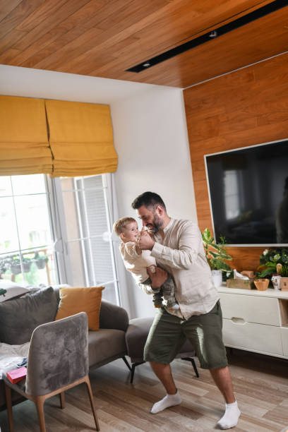 istock Dancing Time For Father And Baby Boy At Home 1618528107