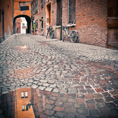 Square image of a small alley in Ferrara (Emilia-Romagna, Italy). 