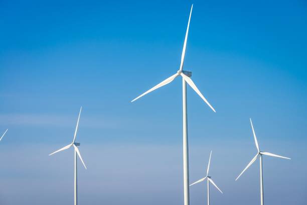istock Wind turbines generating electricity with blue sky background. 1618538535