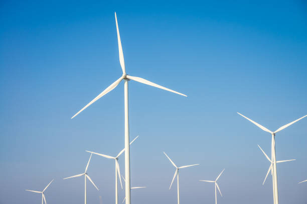 istock Wind turbines generating electricity with blue sky background. 1618538555
