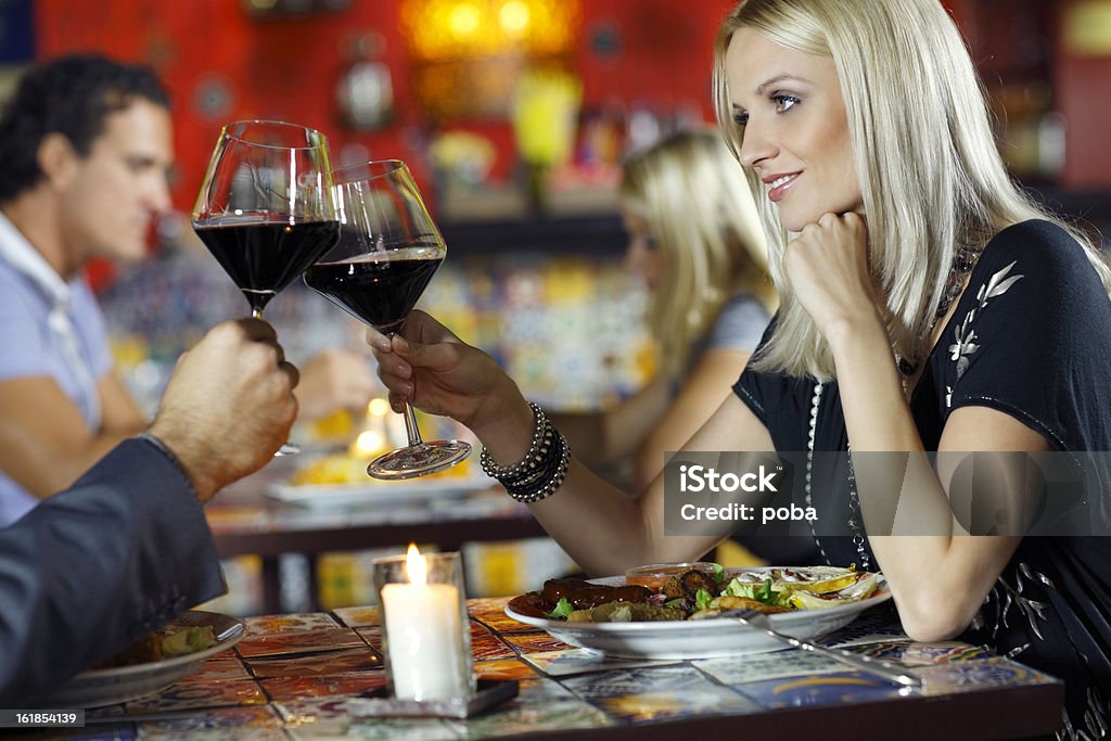 couple enjoys Mexican food dishes  Adult Stock Photo