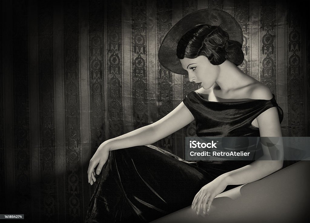 Diva with the hat in film noir style. Emulations of vintage style photography. 1950-1959 Stock Photo