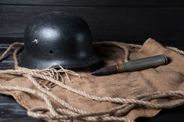 istock still life helmet and heavy cartridge on a black background 1618550740