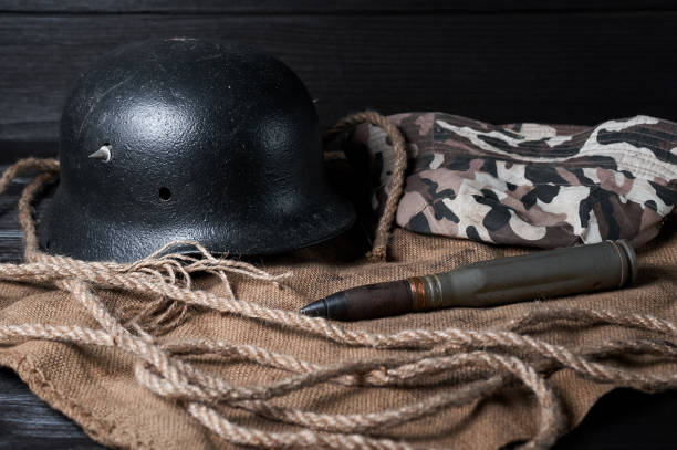 istock still life helmet and heavy cartridge on a black background 1618550747