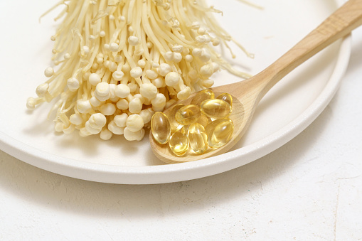 Mushroom or enoki medical use, dietary supplements, pills capsules. Golden needle mushroom.