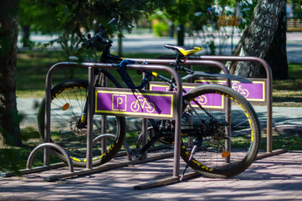 istock Bicycle parking in the parking lot. Summer day, selective focus 1618555136