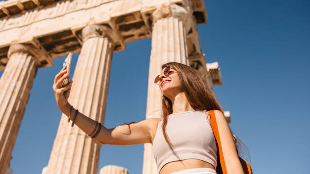 istock Tourist in front of the Parthenon 1618558420