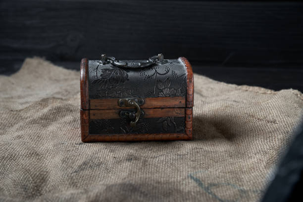 istock old wooden decorative chest on a black background 1618561269