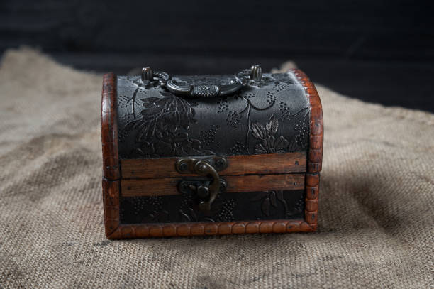 istock old wooden decorative chest on a black background 1618561283