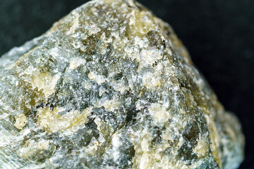 macro shooting of collection natural rock - eudialyte (almandine spar) mineral stone isolated on white background