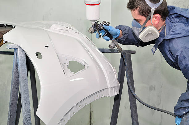 istock Worker painting a car bumper. 161857450