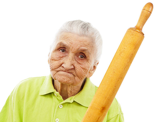 istock angry old woman threatening with a rolling pin 161857466