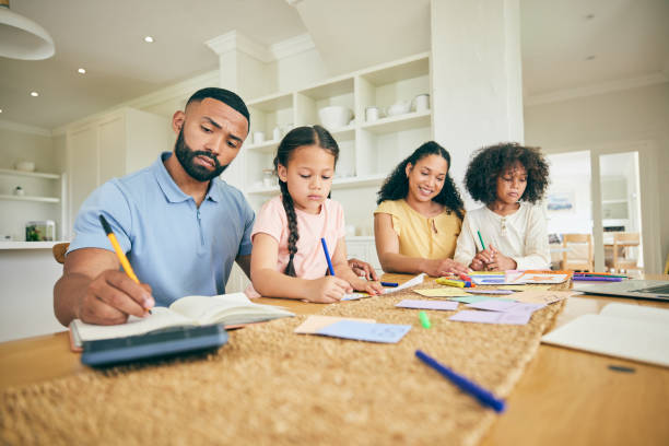 istock Writing, learning and family with children for home education and support in kitchen with parents or mother and father. Biracial kids, mom and dad for teaching, helping and drawing and school books 1618575342