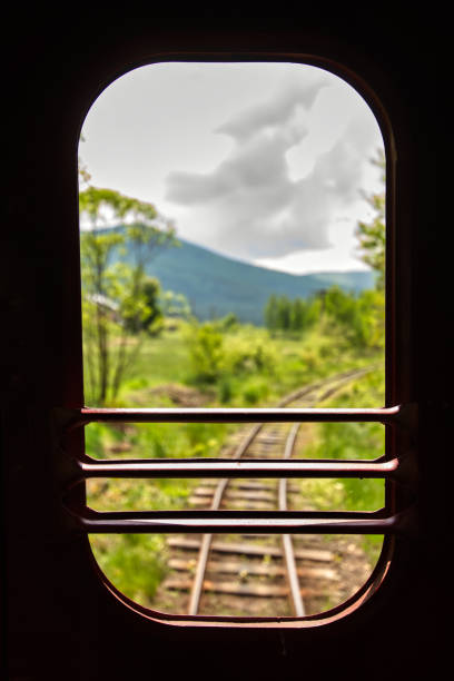 istock Mountain Railway Mystique: A Glimpse from the Darkened Train Carriage 1618575925
