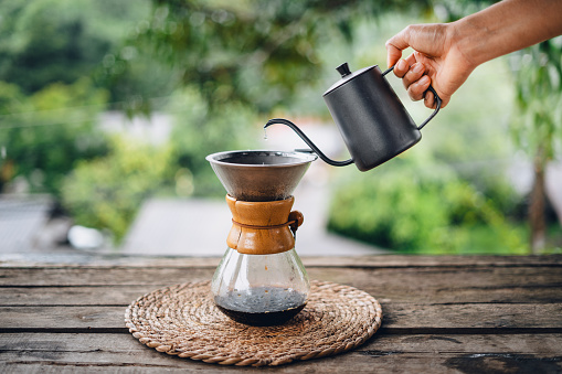 In the morning, drip coffee in front of the balcony