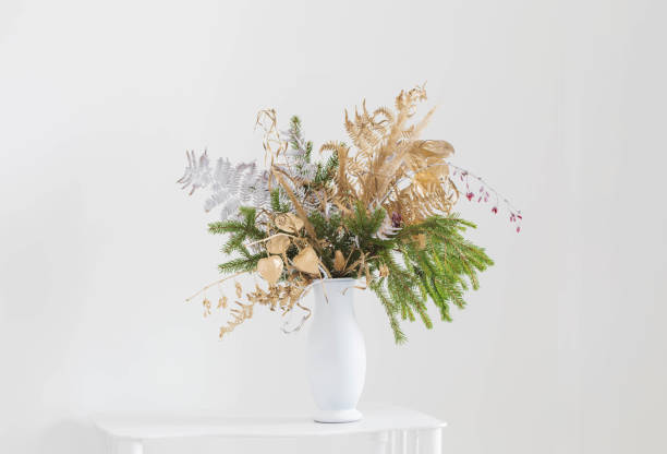 istock christmas bouquet in white vase on white background 1618594886