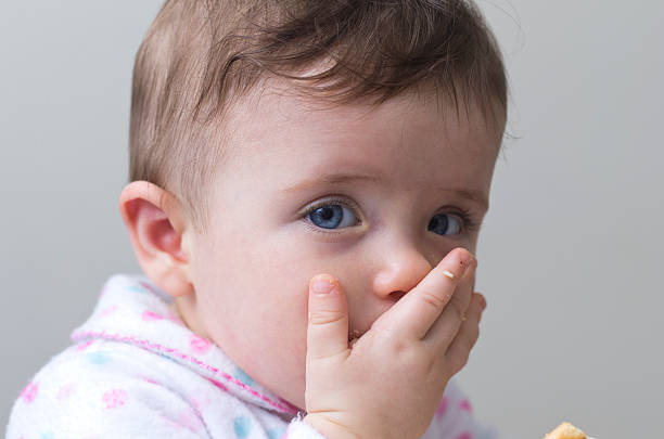 istock Cute little girl eating 161859858