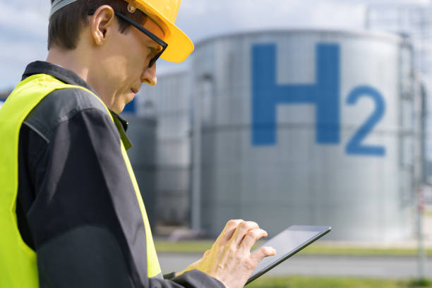 istock Engineer on a background of Hydrogen factory 1618616957