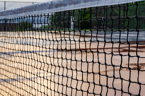 Wet net on a new combined tennis pickleball court