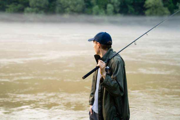 istock Man fishing on the river 1618634321