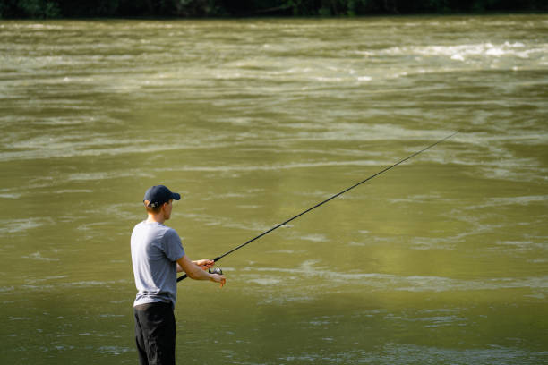 istock Man fishing on the river 1618639731