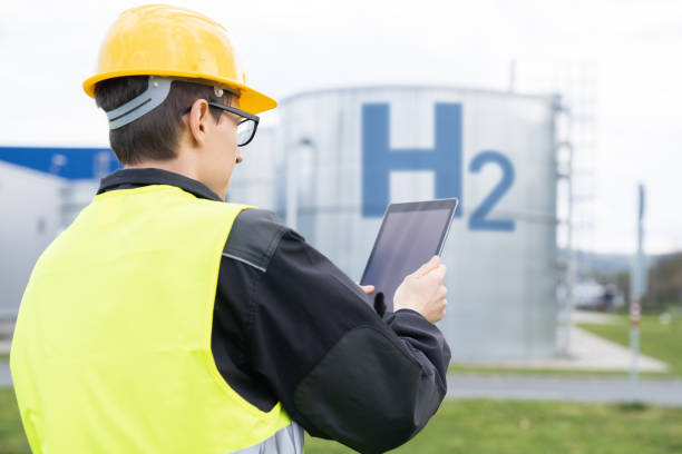 istock Engineer on a background of Hydrogen factory 1618642031