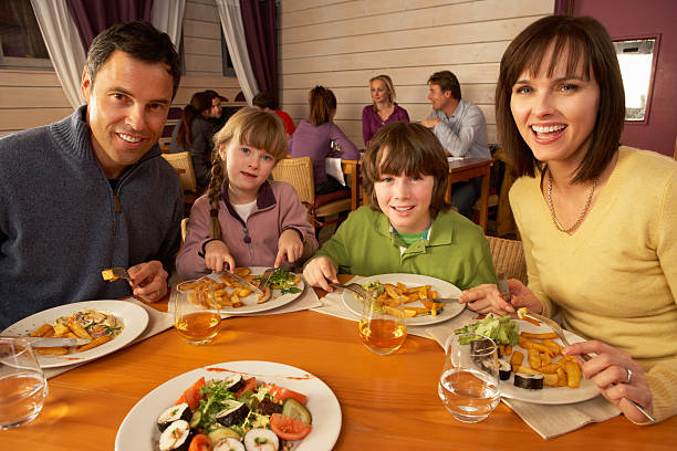 istock Family Eating Lunch Together In Restaurant 161865582